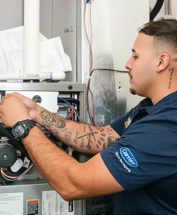 Mighty Pine technician performing maintenance on an HVAC system in a home in Arvada, CO